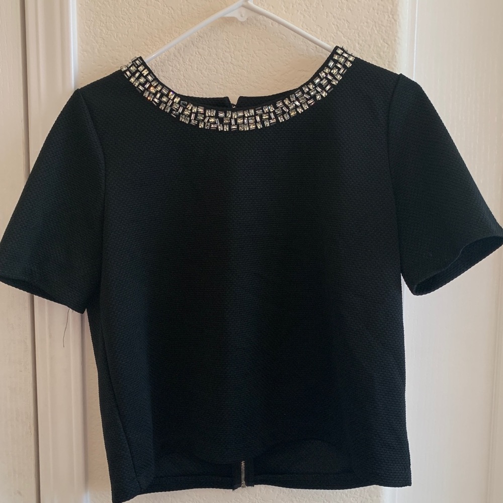 A black top with decorations.